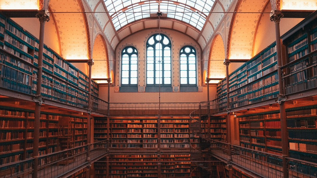 Old library with tall shelves full of books